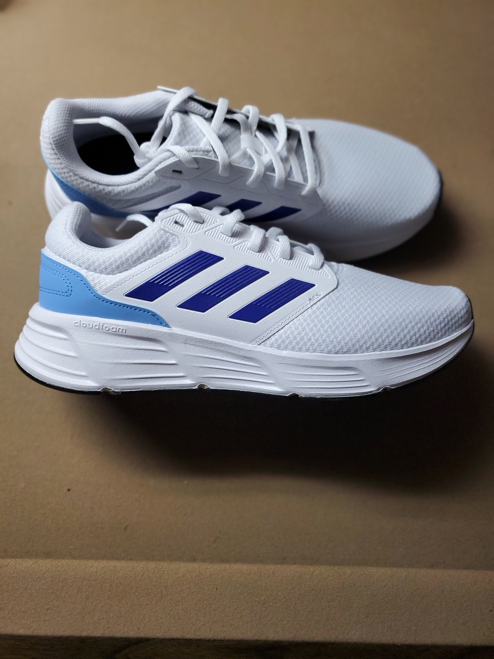 adidas White Athletic Running Shoes with Blue Accents